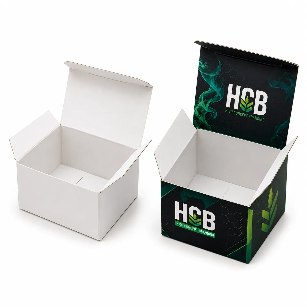 Open cardboard shatter packaging boxes showing a plain white sample and custom dark green branding.